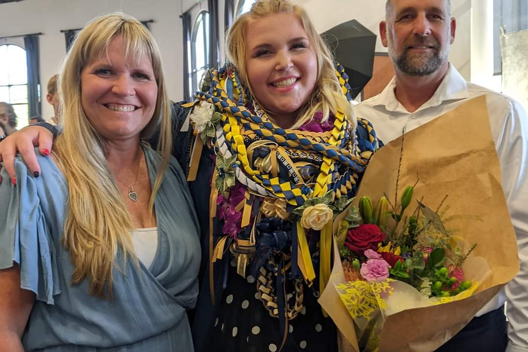 Mary with her family on graduation day